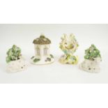 STAFFORDSHIRE POTTERY FIGURES, including a pair of rumbent sheep, cottage burner, watch stand,