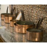 BATTERIE DE CUISINE, a set of six graduated copper pans,