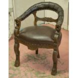 DESK CHAIR, late 19th century oak in brown leather with carved lions head arm terminals.