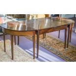 DINING TABLE, George III mahogany with eliptical ends and foldover centre section,