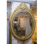 WALL MIRROR, Belle Epoque style gilt framed with oval bevelled plate, 151cm H x 104cm W.