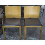 DINING CHAIRS, a set of six, oak with brown leather seats.