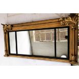 OVERMANTEL, William IV giltwood with triple plates, ebonised slip and carved foliate corners,