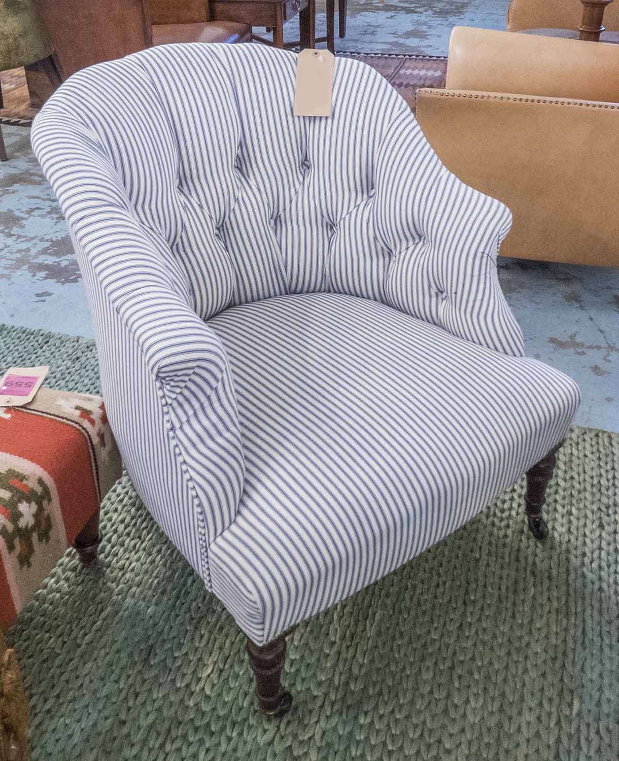 TUB CHAIR, buttoned newly upholstered in ticking on turned tapering supports, 70cm x 81cm H.