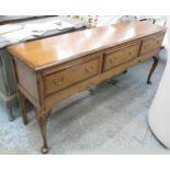 DRESSER BASE, oak with three drawers below on cabriole supports, 183cm x 47cm x 82cm H.