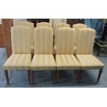 DINING CHAIRS, a set of eight, with gold striped upholstery, 49cm W x 110cm H.