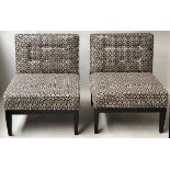 CHAIRS, a pair, buttoned black and white mosaic upholstered with black tapering supports.