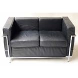 SOFA, Bauhaus style, black leather cushions within a chrome frame, 130cm W x 70cm D.