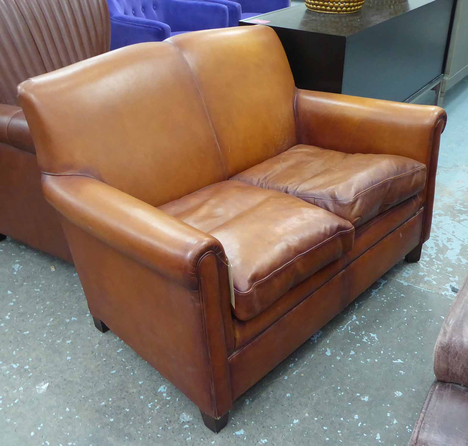 SOFA, tan leather of compact proportions, 128cm x 85cm H x 76cm.