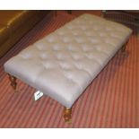 STOOL, with buttoned grey upholstery on short turned supports with castors,