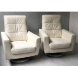 SWIVEL ARMCHAIRS, a pair, contemporary stitched white leather, revolving with metal base, 83cm W.