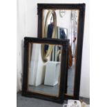 MIRRORS, a set of two, Continental style ebonised, of differing sizes, 168cm x 80cm.