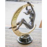 'GIRL SWINGING ON THE MOON', bronze and brass, 60cm H x 45cm W.