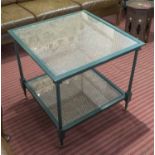 OCCASIONAL TABLE, caned and green painted two with glass tiers, on castors, 64cm H x 66cm W.