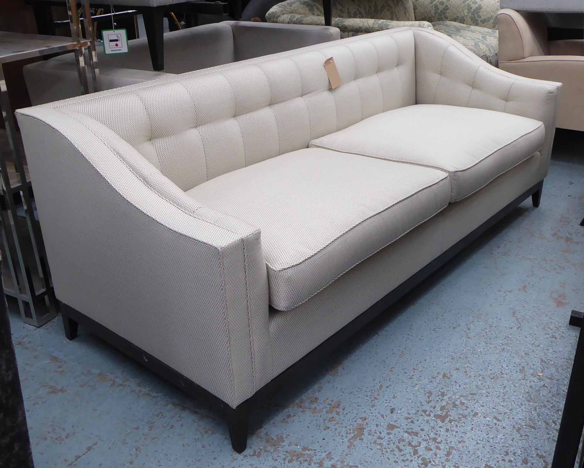 SOFA, contemporary design, on ebonised supports, 210cm W.