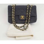 CHANEL CLASSIC FLAP BAG, black fabric with iconic burgundy leather lining, gold tone hardware,