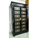 ARMOIRE, French Empire style, ebonised and grey leather lined with gilt metal mounts and two doors,