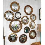 AN ASSEMBLAGE OF TWELVE CONVEX MIRRORS, of various styles, largest 58cm D.