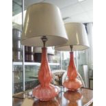 TABLE LAMPS, a pair, Murano style, orange patterned glass with shades, bases each 38cm tall,