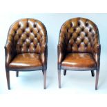 ARMCHAIRS, a pair, library style and hand finished deep button leaf brown leather upholstered,