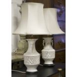 LAMPS, a pair, reticulated white ceramic of vase form with shades, 76cm H.