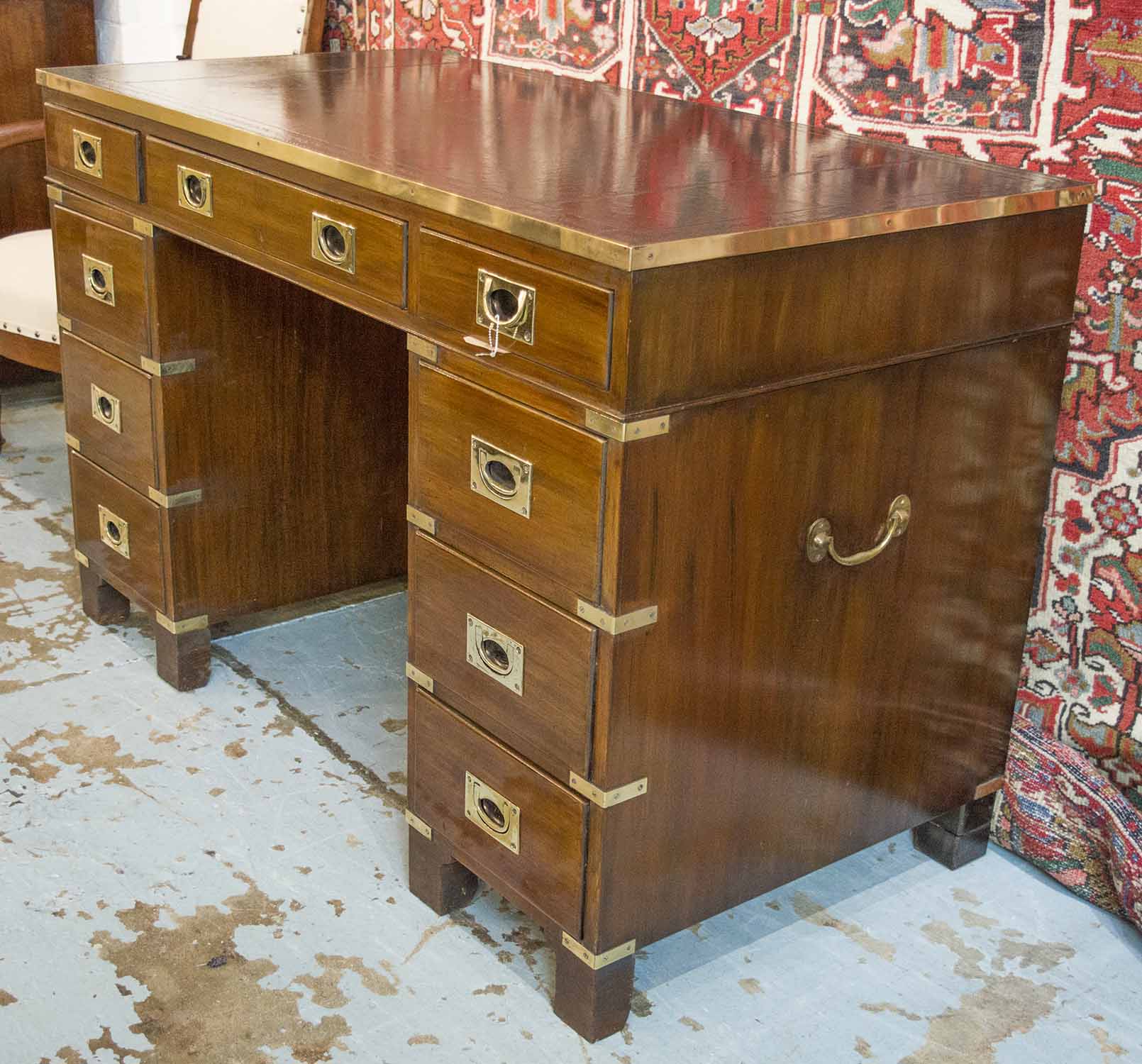 CAMPAIGN STYLE DESK, mahogany and brass bound with leather top above nine drawers, - Image 2 of 2