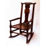 ROCKING ARMCHAIR, early 18th century, Scottish oak, with shaped splat and replaced rocker, 62cm W.