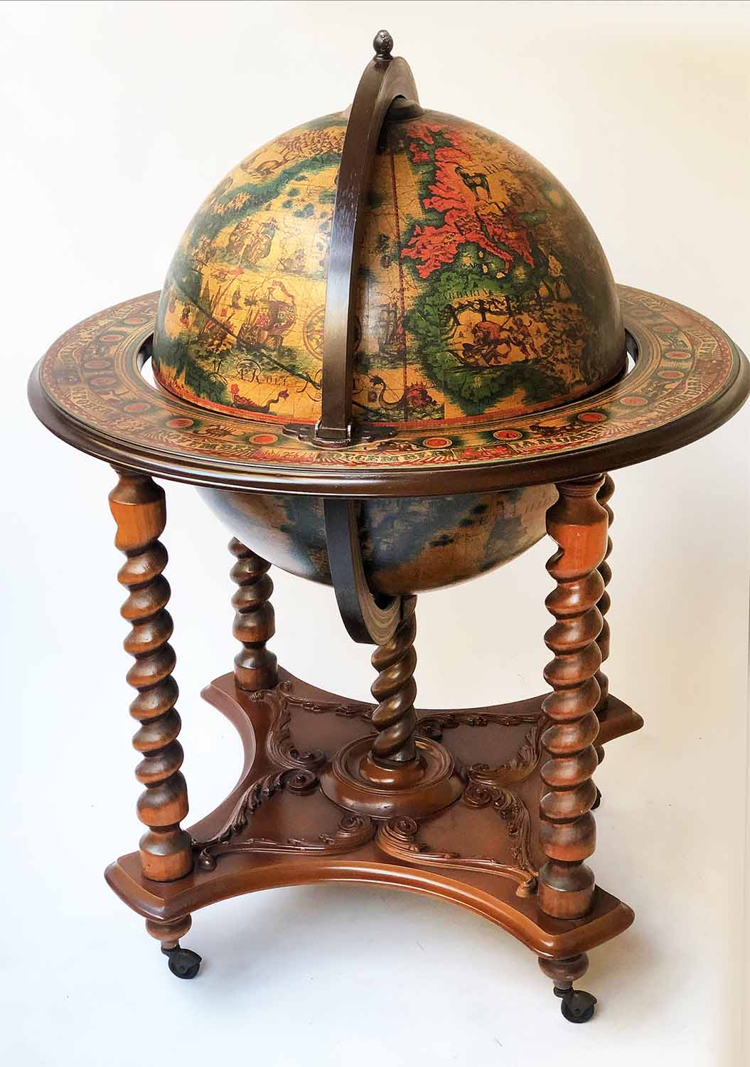 GLOBE COCKTAIL CABINET, in the form of and antique terrestrial globe, on stand,