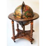 GLOBE COCKTAIL CABINET, in the form of and antique terrestrial globe, on stand,