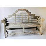 GARDEN BENCH, silvery weathered teak, of slatted construction, after a design by Sir Edwin Lutyens,