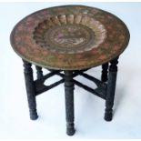 TRAY TABLE, early 20th century Indian, circular brass embossed, hand coloured and incised,
