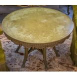 LOW TABLE, circular in a distressed green painted finish with carved and swagged detail,