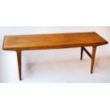 LOW TABLE, 1970s teak, rectangular, with stretchered supports.