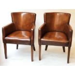BRIDGE ARMCHAIRS, a pair, piped hand finished leaf brown leather, with tapering supports, 62cm W.