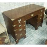 MILITARY STYLE DESK, mahogany and brass bound with nine drawers, 78cm H x 116cm x 56cm.