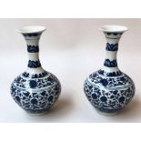 VASES, a pair, Chinese blue and white ceramic of gourd form with foliate detail, 32cm H.