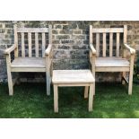 'WESTMINSTER' GARDEN ARMCHAIRS & TABLE, weathered teak, of substantial slatted construction,