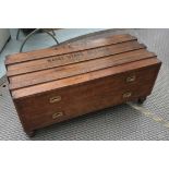 LOW CAMPAIGN CHEST, late 19th century teak, with two long drawers, on turned supports,