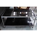 LOW TABLE, smoked glass top with undertier, on a polished metal base, 100cm L x 57cm D x 52cm H.