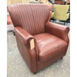 ARMCHAIR, contemporary, upholstered in stitched tan leather with ribbed back,