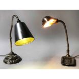 DESK LAMPS, early 20th century, silver metal, with anglepoise adjustable column and heraldic base,