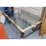 LOW TABLE, with a rectangular glass top framed with a marble effect border, on scrolled supports,