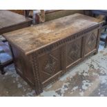 COFFER, Charles II oak with a rising lid and carved triple panel front, 135cm x 57cm x 62cm H.