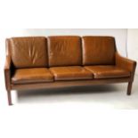 SOFA, 1970 Danish teak three seater in grained mid brown coach leather,