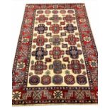 FINE KAZAK CARPET, 257cm x 165cm all over geometric field within corresponding borders.