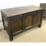 COFFER, 17th century and later carved oak, of planked construction, on square supports,