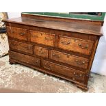 MULE CHEST, 18th century, Lancashire oak, with an arrangement of crossbanded drawers,