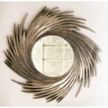 STARBURST WALL MIRROR, the circular bevelled mirror, within a swirling grey frame, 105cm diam.