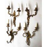 WALL LIGHTS, a set of three, Louis XV style, gilt metal, each foliate two branch,