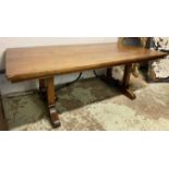 DINING TABLE, Spanish style having a scrolling cast iron stretcher and plank top,